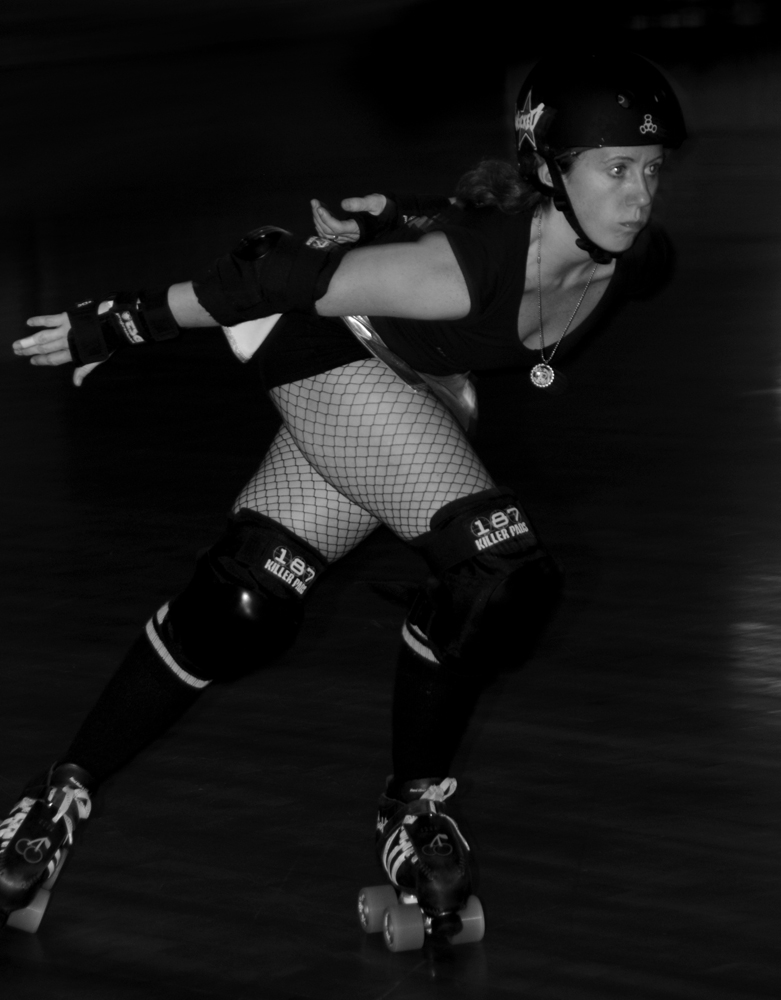 Cherry Lifesaver roller derby skater action shot
