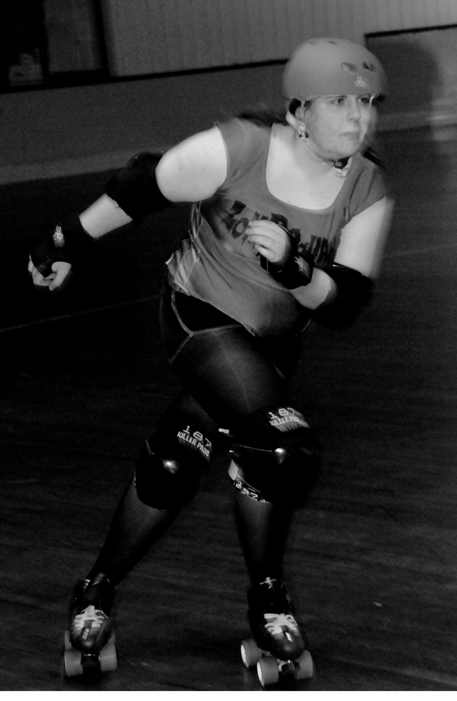 Mirakle Whip Roller Derby Skater Action Shot Mirakle Whip Roller Derby Skater Action Shot
